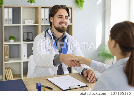Doctor consulting patient in modern clinic office, discussing diagnosis and care Doctor consulting patient in modern clinic office, discussing diagnosis and care 137195180