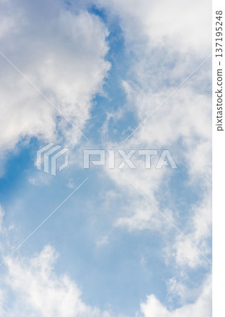 Looking up at the early winter sky: Close-up of blue sky and fluffy clouds 105 Looking up at the early winter sky: Close-up of blue sky and fluffy clouds 105 137195248