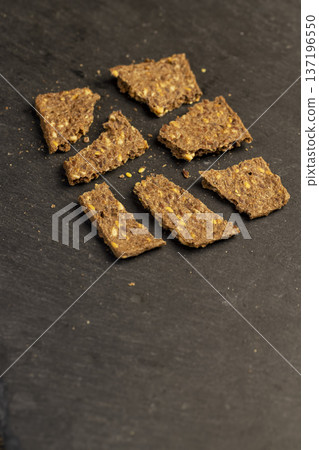 thin natural hard dry rye flour loaves with flax seeds and wheat fiber, natural loaves from a complex of ingredients for dietary nutrition thin natural hard dry rye flour loaves with flax seeds and wheat fiber, natural loaves from a complex of ingredients for dietary nutrition 137196550