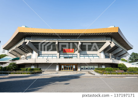 Building view of the Nippon Budokan, it is an indoor arena in Kitanomaru Park, Chiyoda, Tokyo, Japan. Building view of the Nippon Budokan, it is an indoor arena in Kitanomaru Park, Chiyoda, Tokyo, Japan. 137197171