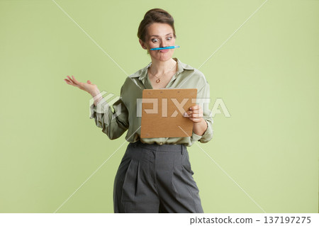 Playful businesswoman with pen Playful businesswoman with pen 137197275