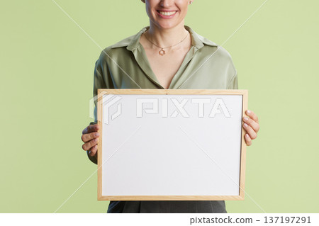 Smiling woman presenting whiteboard Smiling woman presenting whiteboard 137197291