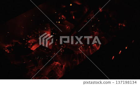 closeup of hot charcoal in dark environment closeup of hot charcoal in dark environment 137198134