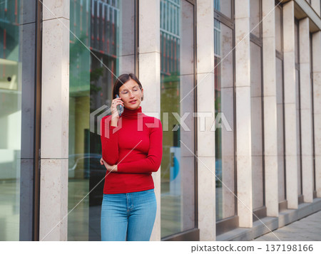 Woman in glasses stands in center of Frankfurt, Woman in glasses stands in center of Frankfurt, 137198166