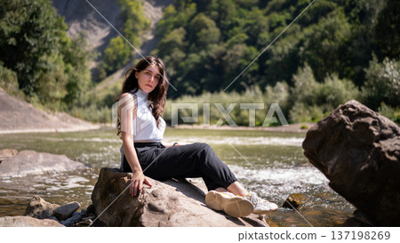 Natural Portrait of a Young Woman by a Mountain River Natural Portrait of a Young Woman by a Mountain River 137198269