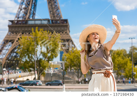 Happy Tourist Captures Selfie at Eiffel Tower 137198430