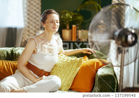 Serene Woman Finding Relief from Summer Heat 137199548