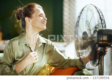 Serene Woman Enjoying Cool Breeze at Home Serene Woman Enjoying Cool Breeze at Home 137199558