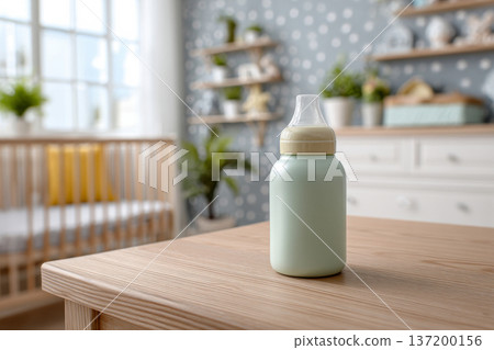 baby bottle on wooden changing table in bright nursery, soft pastel decor blurred in background, natural daylight illumination, minimalistic and clean setting, horizontal framing 137200156