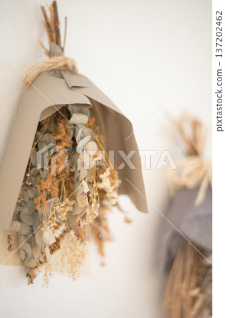 Dried flowers hanging on the wall Dried flowers hanging on the wall 137202462