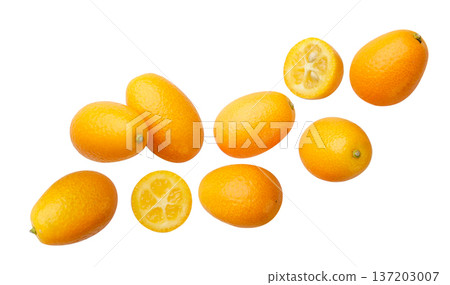 Kumquat fruits and halves flying on a white background. Isolated Kumquat fruits and halves flying on a white background. Isolated 137203007