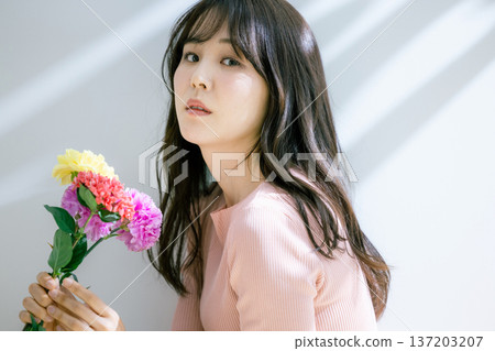 A woman with flowers 137203207