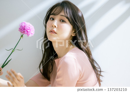 A woman with flowers 137203210