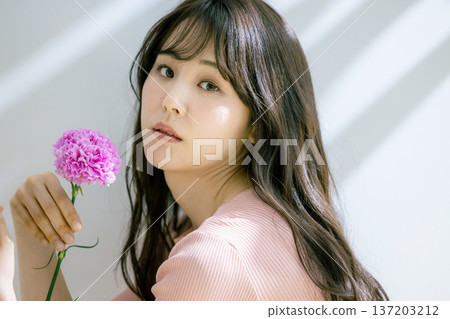 A woman with flowers 137203212