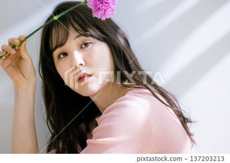 A woman with flowers 137203213