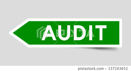 Green color arrow shape sticker label with word audit on gray background 137203652