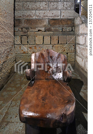 Reclining chairs placed in the remains of an underground mine Reclining chairs placed in the remains of an underground mine 137204511