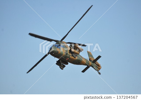 A Self-Defense Force military helicopter flying towards us 137204567