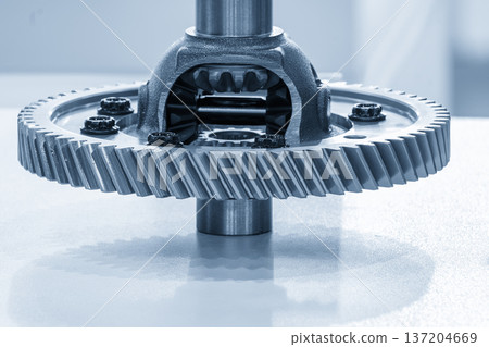 High-precision automotive transmission gear components featuring optimized tooth profiles and surface hardening in a blue-toned industrial scene. 137204669