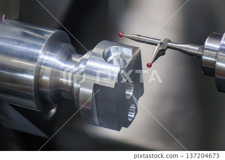 Automated in-process quality control on a CNC lathe using a high-precision modular touching probe for dimensional verification. 137204673