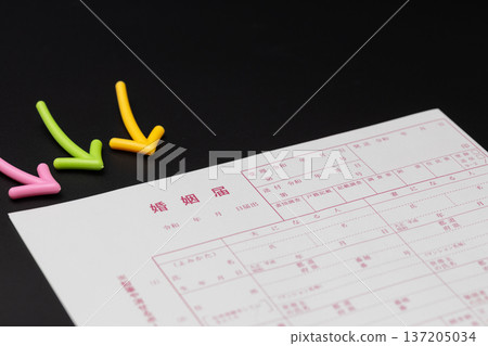 Marriage registration form and arrow The colorful arrow points to the marriage registration form 137205034
