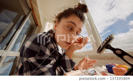 Professional beauty routine captured during studio photoshoot preparation 137205804