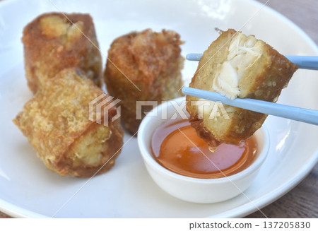 deep fried mashed crab meat roll dumpling Chinese food on plate dipping sweet plum sauce deep fried mashed crab meat roll dumpling Chinese food on plate dipping sweet plum sauce 137205830