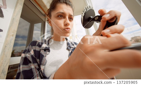 Creative woman applying intense eyeliner with makeup palette nearby 137205905