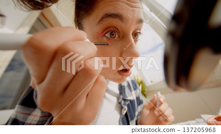 Actor meticulously creating theatrical look before show begins Actor meticulously creating theatrical look before show begins 137205968