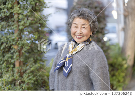 Senior woman looking at camera and smiling 137206248