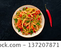 Chow Mein noodles with chicken and vegetables, overhead flat lay shot 137207871