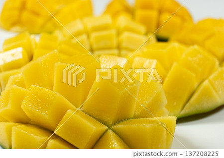 Juicy mango halves with cube cut pattern. 137208225