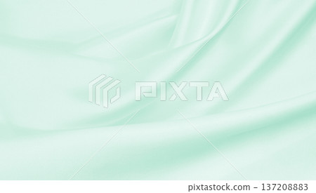 Smooth elegant green silk or satin luxury cloth texture as abstract background. Luxurious background design Smooth elegant green silk or satin luxury cloth texture as abstract background. Luxurious background design 137208883