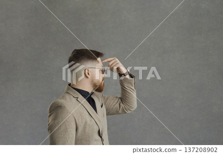 Portrait of business man thinking putting finger on forehead in concentration Portrait of business man thinking putting finger on forehead in concentration 137208902
