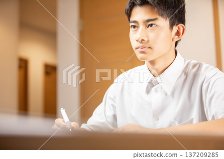 Students attending classes with serious expressions Students attending classes with serious expressions 137209285
