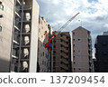 High-rise Akisame housing building and construction cranes 137209454