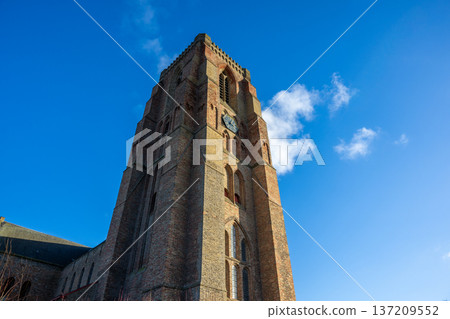 Church of the Visitation and winter sky in Lissewege, a white village in Belgium Church of the Visitation and winter sky in Lissewege, a white village in Belgium 137209552