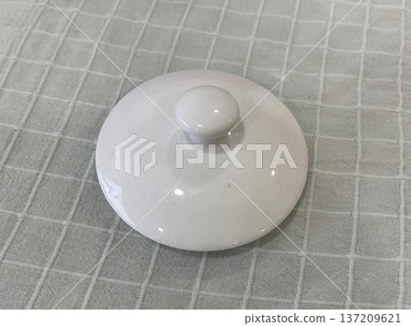 a lid of a bowl on the table a lid of a bowl on the table 137209621