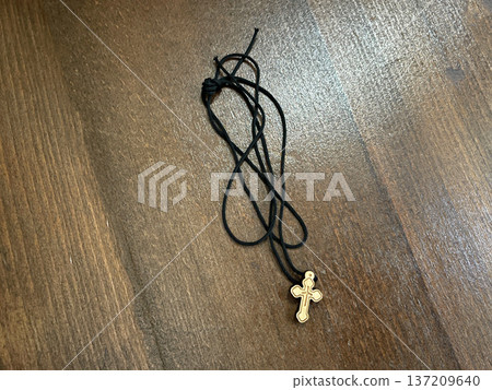 pectoral cross on the wooden background 137209640