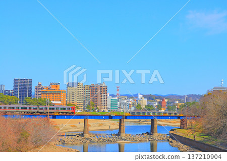 Okazaki City, Aichi Prefecture, scenery of the townscape of Okazaki City and Meitetsu train 137210904