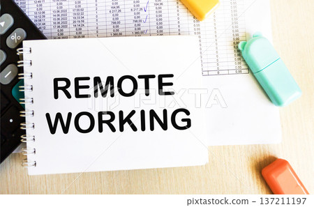 Text Remote work on a notepad with a calculator Text Remote work on a notepad with a calculator 137211197