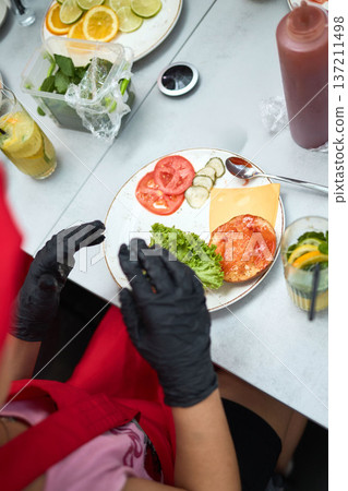 Burger ingredients arranged on plate for assembly Burger ingredients arranged on plate for assembly 137211498