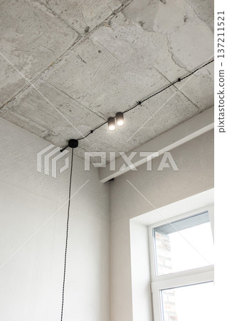Concrete ceiling corner with minimalist pendant light Concrete ceiling corner with minimalist pendant light 137211521