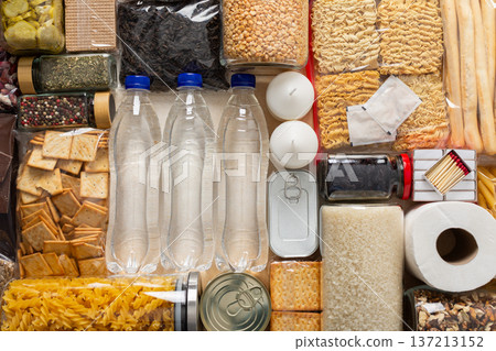 Home food supplies for quarantine and isolation, including canned food, cereals, pasta, and essential staples for survival, survival during military operations, the concept of stay at home Home food supplies for quarantine and isolation, including canned food, cereals, pasta, and essential staples for survival, survival during military operations, the concept of stay at home 137213152
