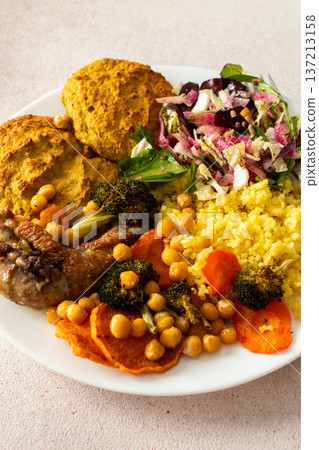 A filling, balanced breakfast with lentil and zucchini pancakes, millet, baked chicken neck, roasted sweet potatoes, broccoli, carrots, chickpeas, and a fresh salad with radish, sprouts, and nuts A filling, balanced breakfast with lentil and zucchini pancakes, millet, baked chicken neck, roasted sweet potatoes, broccoli, carrots, chickpeas, and a fresh salad with radish, sprouts, and nuts 137213158