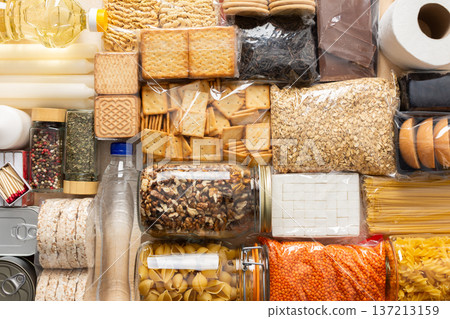 Essential home food stock for military operations and crises and for the period of quarantine and isolation, canned food, pasta, flour and nonperishable items,the concept of stay at home 137213159