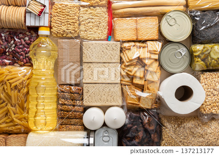 Home food supplies for quarantine and isolation, including canned food, cereals, pasta, and essential staples for survival, survival during military operations, the concept of stay at home Home food supplies for quarantine and isolation, including canned food, cereals, pasta, and essential staples for survival, survival during military operations, the concept of stay at home 137213177