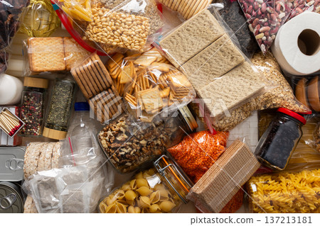 Essential home food stock for military operations and crises and for the period of quarantine and isolation, canned food, pasta, flour and nonperishable items,the concept of stay at home 137213181