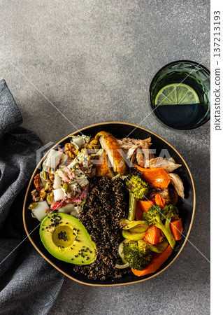 A hearty, balanced breakfast bowl with black quinoa, creamy avocado, roast chicken, sweet potatoes, zucchini, broccoli, and a fresh salad of cabbage and radish with chia and sesame seeds A hearty, balanced breakfast bowl with black quinoa, creamy avocado, roast chicken, sweet potatoes, zucchini, broccoli, and a fresh salad of cabbage and radish with chia and sesame seeds 137213193