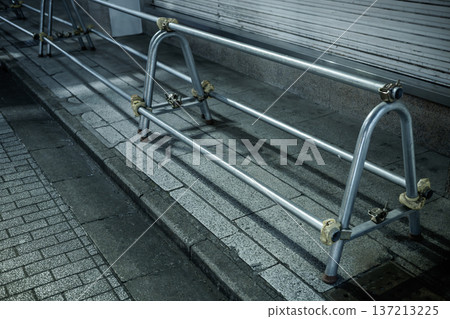 Single-pipe barricades installed as a nighttime crime prevention measure 137213225